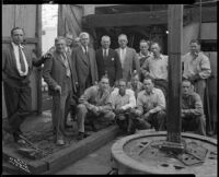 Group portrait of of men on the drill floor of an oil well at the Venice or Playa del Rey oil field, Los Angeles, circa 1930