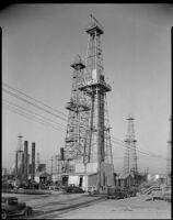 Oil derricks, probably at the Venice oil field, Los Angeles, circa 1930