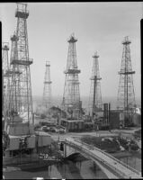 Oil derricks probably at the Venice oil field, Los Angeles, circa 1930