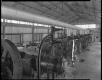 Petroleum industry machinery in a wooden building, California, 1930-1939