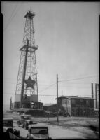 Oil well and field office of the Pacific Shore Oil Company LTD., probably at the Venice oil field, Los Angeles, circa 1930