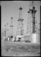 Oil wells, probably at the Venice oil field, Los Angeles, circa 1930