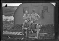 H. H. West, Jr. and 3 fellow servicemen pose in front of their quarters, Dutch Harbor, 1943
