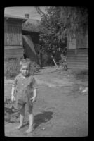 Dennis Albert Deaver stands in the Wilson's yard (negative), Sierra Madre, 1943