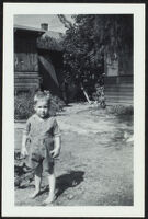 Dennis Albert Deaver stands in the Wilson's yard (photo, recto), Sierra Madre, 1943
