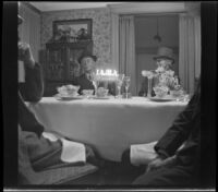 Dr. Bim Smith and Agnes Whitaker sit at the West's dining table during a birthday dinner, Los Angeles, 1944