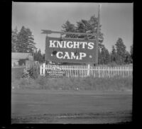 Signage for Knights Camp sitting along the roadside, Big Bear Lake, 1944