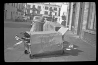 Boxes of Stakmore folding chairs sit on the sidewalk outside the H. H. West Company, Los Angeles, 1945