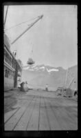 Distant view of the Aleutian unloading its cargo, Valdez, 1946