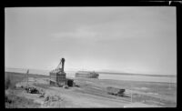 Distant view of a crushed rock plant and Liberty Ship, Anchorage, 1946