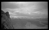 View from a grade overloooking a watercourse from the mountains, Denali National Park and Preserve, 1946