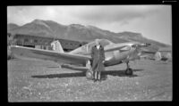 Mertie West poses in front of an airplane, Denali National Park and Preserve vicinity, 1946