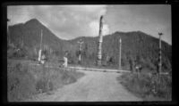Totem poles stand at Saxman Totem Park, Saxman, 1946
