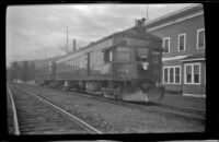 Train sitting on the tracks in front the hotel, Curry, 1946