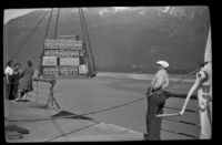 Crates of Darigold Milk being unloaded from the Aleutian, Valdez, 1946