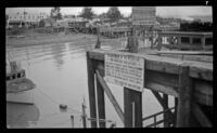 Signs posted on the dock, Seward, 1946