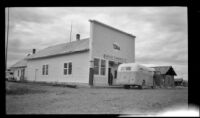 Bus parked in front of Northern Commerical Co. store, Circle, 1946