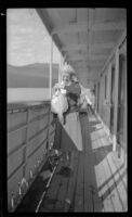 Mertie West poses with a flounder, Juneau, 1946