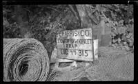 P. E. Harris fish trap sign surrounded by fish netting, Juneau, 1946