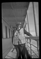 H. H. West poses in his life jacket, Alaska en route, 1946