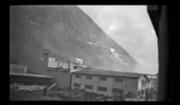 Juneau Cold Storage Co. Inc. and other dockside buildings viewed from a ship, Juneau, 1946