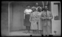 Frances L. Wells, Mertie West, Richard Siemsen, Mrs. H. H. West, Jr. and H. H. West, Jr. pose on the front porch of H. H. West's residence, Los Angeles, 1946