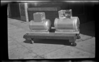 Close-up of 2 butane tanks sit outside the H. H. West Company offices on Omar Avenue, Los Angeles, 1946