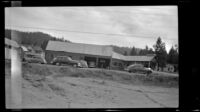 Service station standing at the corner of the highway and street to dock, Big Bear Lake, 1946