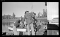 Forrest Whitaker, Hebard West and Ann West loading the boat, Big Bear Lake, 1946