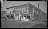 View of a 2-story building that formerly housed the County Treasurer's office and Morrell's grocery, Red Oak, 1946