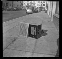 Deluxe Floor Heater sitting on the sidewalk outside 314 Omar Avenue, Los Angeles, 1947