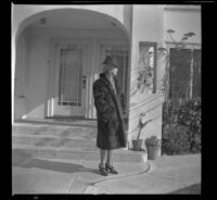 Mertie West stands outside her residence at North Ridgewood Place, Los Angeles, 1947