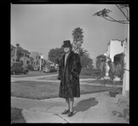 Mertie West stands on the walkway outside her home at North Ridgewood Place, Los Angeles, 1947