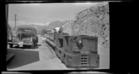 Passengers sit aboard the narrow gauge train at Ryan, Death Valley National Park vicinity, 1947