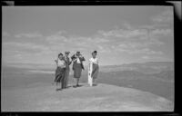 Zetta Witherby, Wes Witherby, Dode Witherby and Mertie West pose atop the Ubehebe Crater's rim, Death Valley National Park, 1947