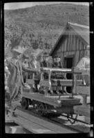 Wes Witherby, Mertie West, Dode Witherby and Zetta Witherby at the narrow gauge train in Ryan, Death Valley National Park vicinity, 1947