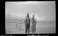 Double-exposure of H. H. West and Mertie West posing at Badwater Basin, Death Valley National Park, 1947