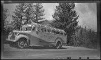Rocky Mountain Tours bus stopped along the roadside, Banff vicinity, 1947
