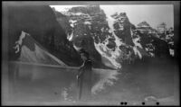 Mertie West stands at the edge of Moraine Lake, Banff National Park, 1947