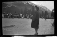 Mertie West stands on a terrace at the Banff Springs Hotel, Banff, 1947