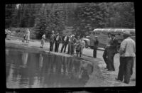 Sightseers gather around trout pools on drive, Banff National Park, 1947