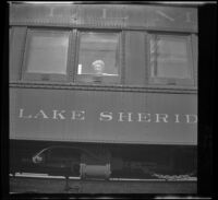 Mertie West sits aboard the Pullman train, Lake Sheridan, Mount Shasta vicinity, 1947