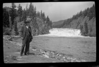 H. H. West poses by Bow Falls, Banff, 1947