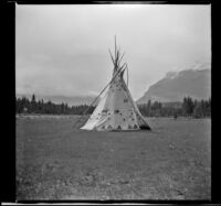 Tipi standing at the horse corral, Lake Louise, 1947