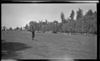 Mertie West stands on a lawn in Stanley Park, Vancouver, 1947