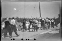Crowd of people, just off street cars, walking in Stanley Park, Vancouver, 1947