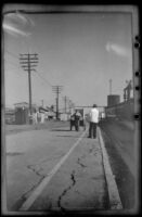 African-American railroad porter stands on the station's platform, Klamath Falls, 1947