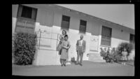Ann West, Mertie West and H. H. West, Jr. pose in front of their room at Topper's Motel, Ventura, 1947