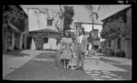 Ann West and H. H. West, Jr. pose in the courtyard at El Paseo, Santa Barbara, 1947
