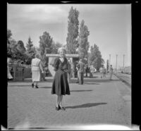 Mertie West stands on the platform a the Albuquerque train station, Albuquerque, 1947